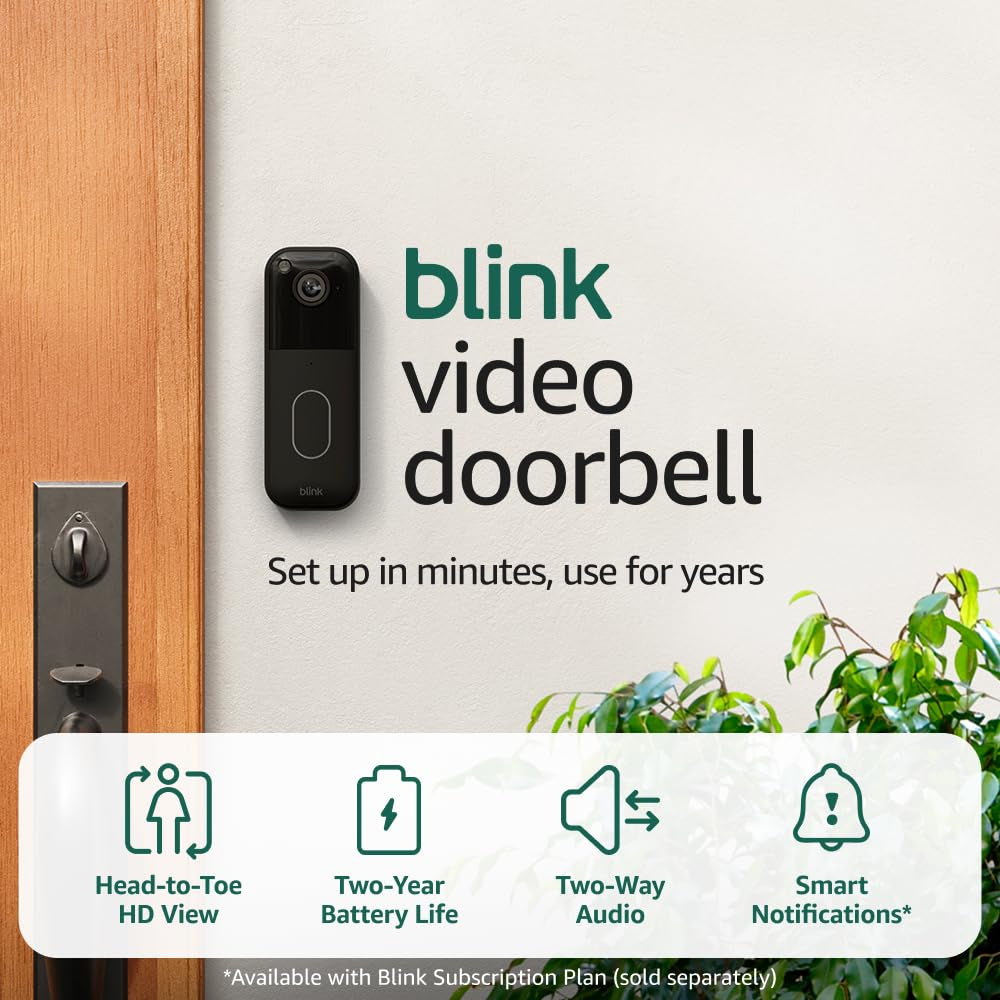 Battery video doorbell installed on a modern front door with HD camera